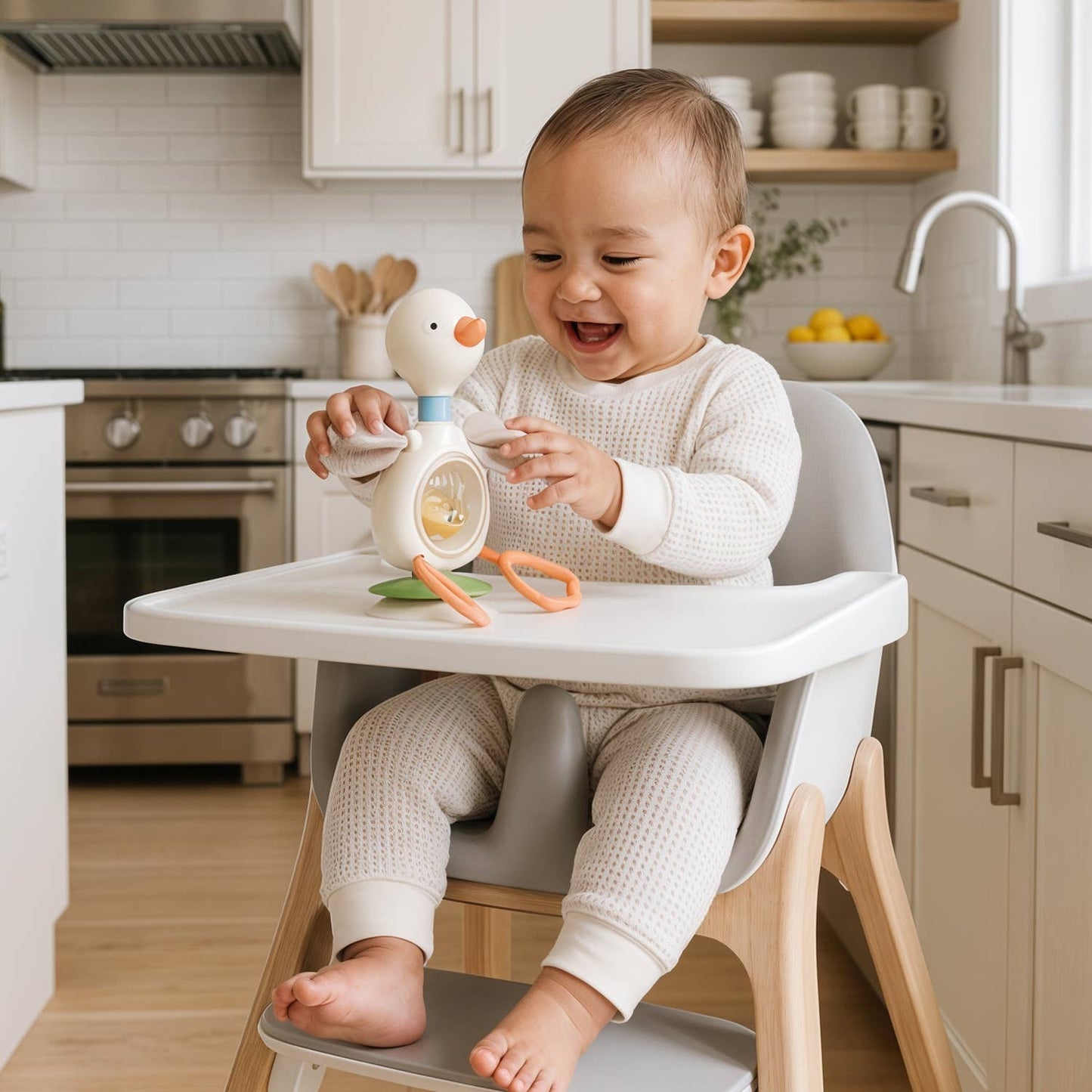 Itzy Ritzy | Itzy Twist & Bop™ - High Chair Sensory Toy Goose