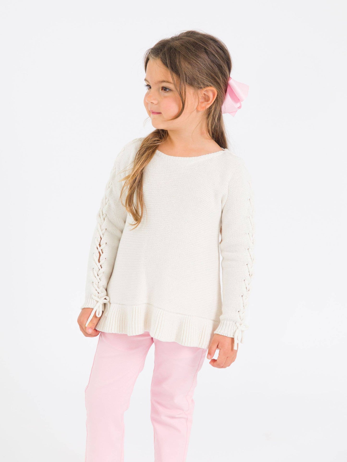 RuffleButts + RuggedButts - Girls Ivory Ruffle Hem Lace Up Sweater