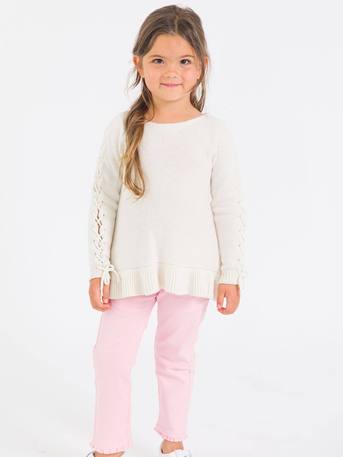 RuffleButts + RuggedButts - Girls Ivory Ruffle Hem Lace Up Sweater