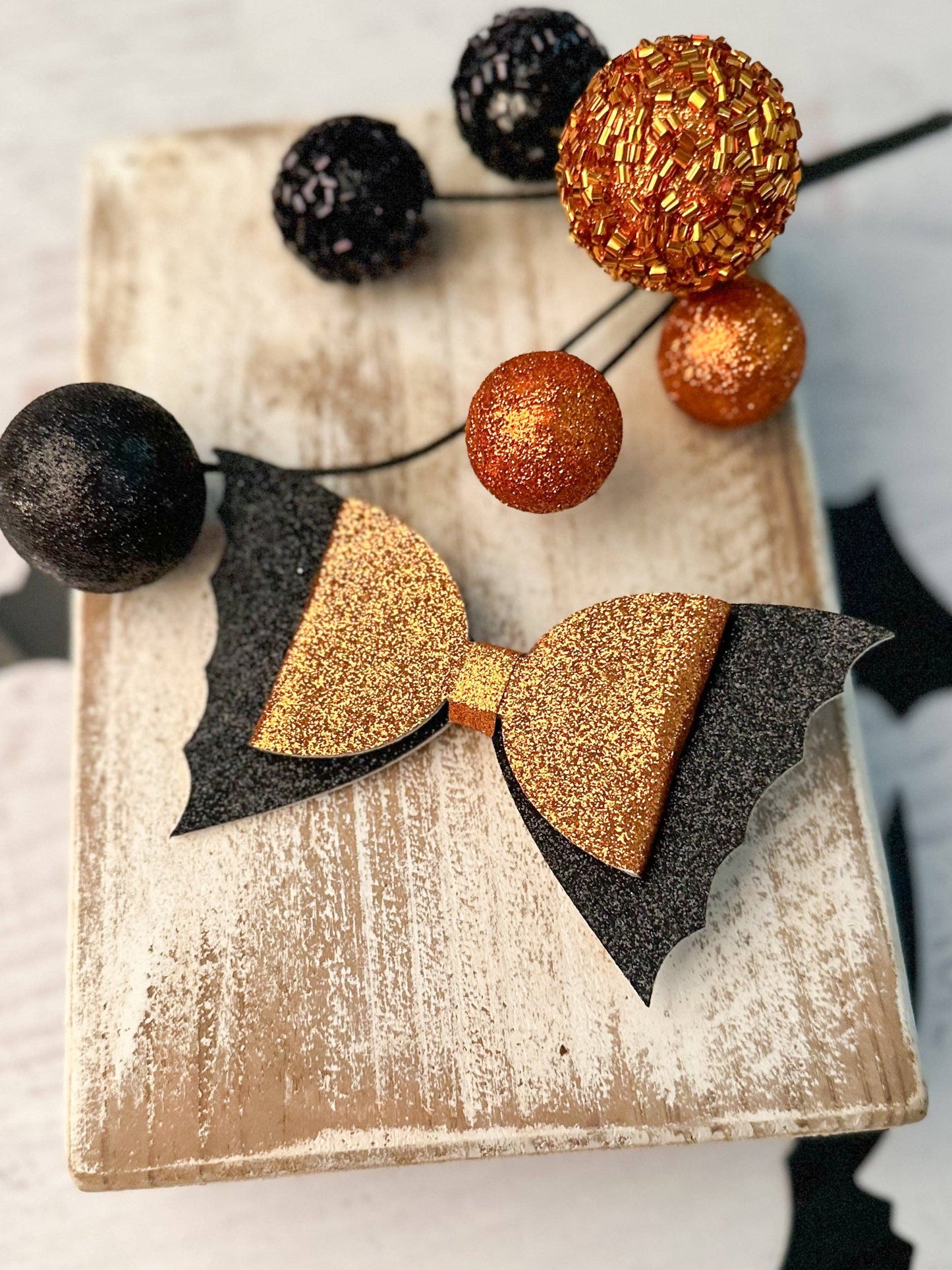 Orange Glitter Bow Bat Clippie